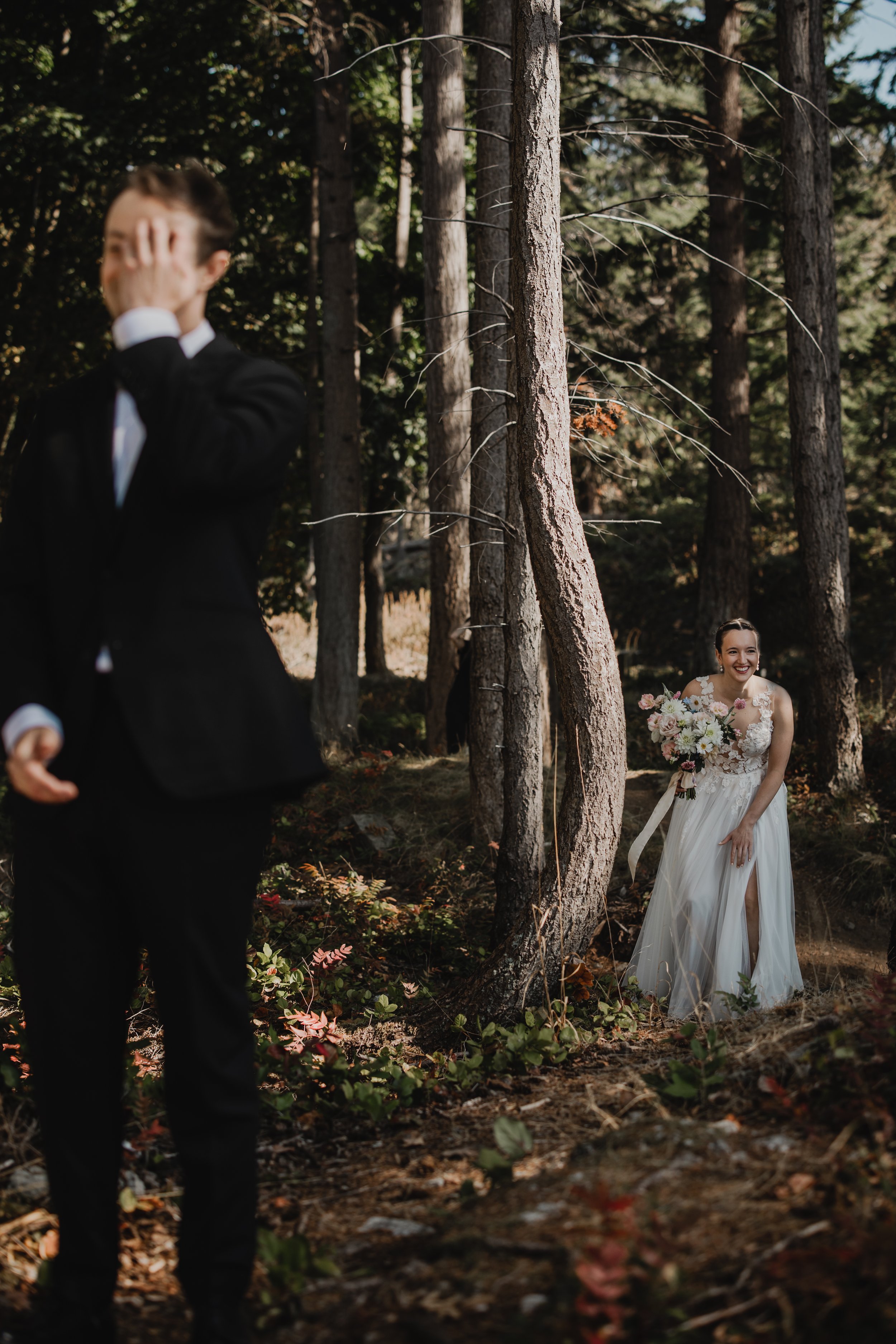 An elopement couple enjoying their first look while eloping with Sea to Sky Studios on Bowen Island.